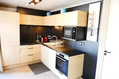 Cuisine ou kitchenette dans l'établissement Escales Voyages Cottage des Dunes - Chalet de 49m2 climatisé - 6 personnes