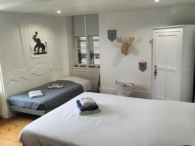 Un ou plusieurs lits dans un hébergement de l'établissement La chambre des Remparts
