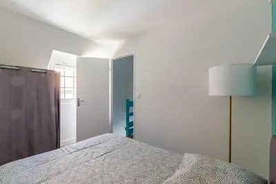 Un ou plusieurs lits dans un hébergement de l'établissement Azul - Maison avec jardin à 200m de la plage