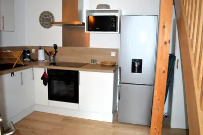 Cuisine ou kitchenette dans l'établissement Le Gambetta, 100m de la plage