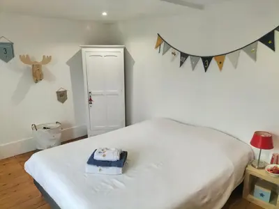 Un ou plusieurs lits dans un hébergement de l'établissement La maison des Remparts