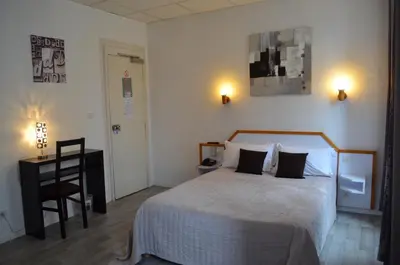Un ou plusieurs lits dans un hébergement de l'établissement Hôtel de La Croix de Malte