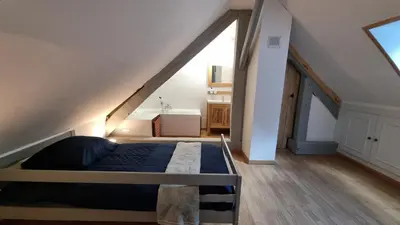 Un ou plusieurs lits dans un hébergement de l'établissement Maison au cœur des Bois