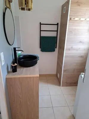 Salle de bains dans l'établissement Le Nature