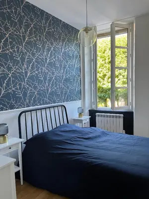 Un ou plusieurs lits dans un hébergement de l'établissement Bright Apt 70m2 in Bayeux historic center w Pkg