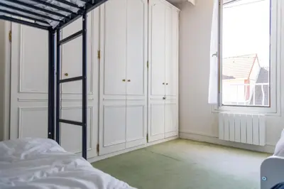 Un ou plusieurs lits dans un hébergement de l'établissement La Maison Cabourgeaise proche mer