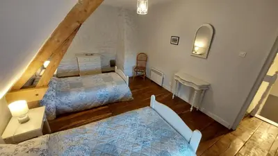 Un ou plusieurs lits dans un hébergement de l'établissement Gîte charmant à la campagne