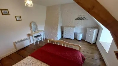 Un ou plusieurs lits dans un hébergement de l'établissement Gîte charmant à la campagne