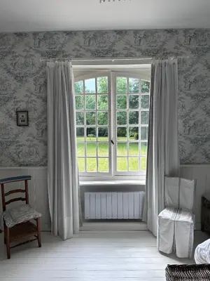 Un ou plusieurs lits dans un hébergement de l'établissement Manoir Charme Baie Mont St Michel