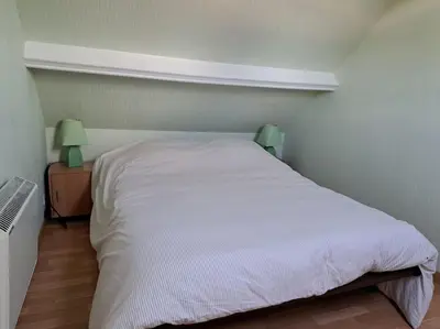 Un ou plusieurs lits dans un hébergement de l'établissement Gîte Le Scoubidou, bord de mer
