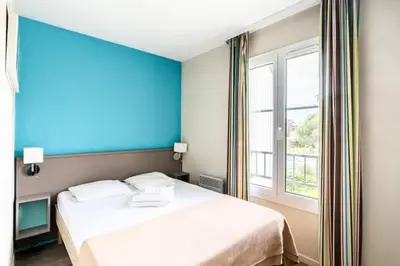 Un ou plusieurs lits dans un hébergement de l'établissement Résidence Port Guillaume - maeva Home - Maison 3 pièces 6 personnes - Budget MAE-5714
