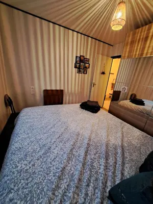 Un ou plusieurs lits dans un hébergement de l'établissement Eco-Logis le 50, maison avec jardins et terrasse privatifs
