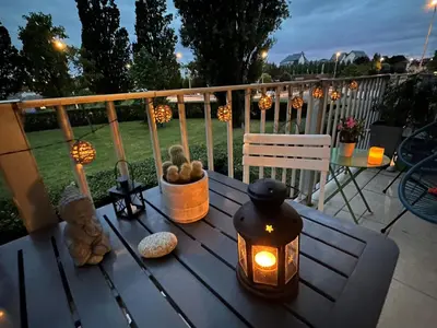 Balcon ou terrasse dans l'établissement Charmant 2 pièces, balcon, proche centre-ville Cabourg, 4 pers, parking sécurisé - FR-1-487-360