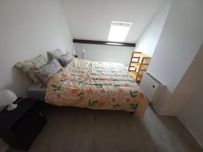 Un ou plusieurs lits dans un hébergement de l'établissement confortable appartement duplex