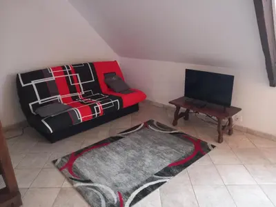 Télévision ou salle de divertissement dans l'établissement confortable appartement duplex