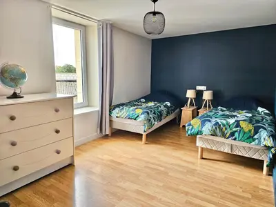 Un ou plusieurs lits dans un hébergement de l'établissement les chambres d'hôtes la Guiberdière