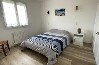 Un ou plusieurs lits dans un hébergement de l'établissement Maison vue mer Omaha Beach