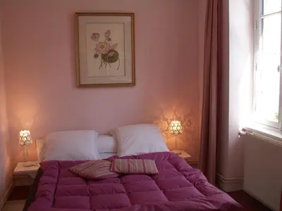 Un ou plusieurs lits dans un hébergement de l'établissement Dodo et tartines B&B