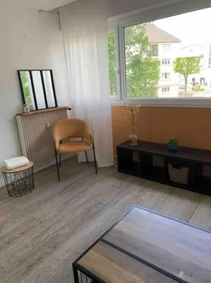 Coin salon dans l'établissement Charmant studio cosy avec parking