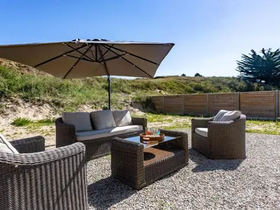 Coin salon dans l'établissement Holiday Home La Dune by Interhome