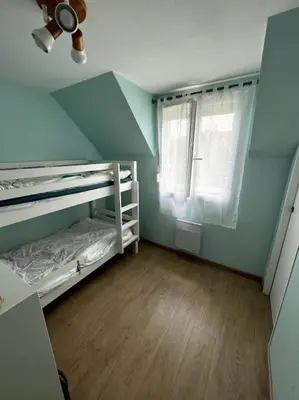 Un ou plusieurs lits dans un hébergement de l'établissement Maison à 3 min de Cabourg / 5min à pieds de la mer