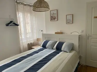 Un ou plusieurs lits dans un hébergement de l'établissement Maison de ville avec parking - Caen centre