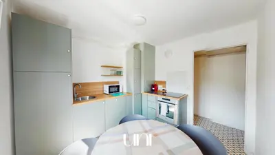 Cuisine ou kitchenette dans l'établissement Appartement cosy d'Auge
