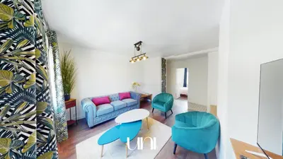 Coin salon dans l'établissement Appartement cosy d'Auge