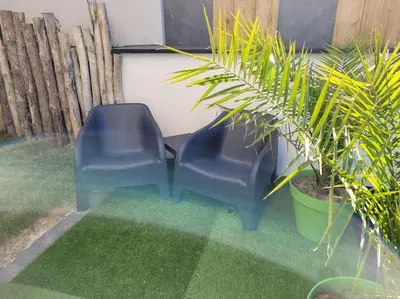 Coin salon dans l'établissement L'Escapade T1 de 30 m2 neuf.