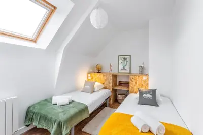 Un ou plusieurs lits dans un hébergement de l'établissement La maison d'Amélie Cancale
