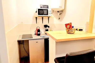 Cuisine ou kitchenette dans l'établissement Le petit Cocon Bleu