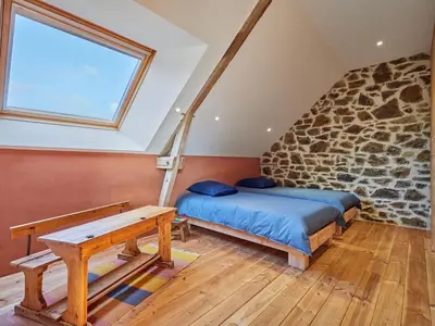 Un ou plusieurs lits dans un hébergement de l'établissement Holiday Home La Favrais by Interhome