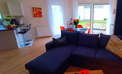 Coin salon dans l'établissement Appartement avec jardin - Centre-ville à 10 minutes à pied