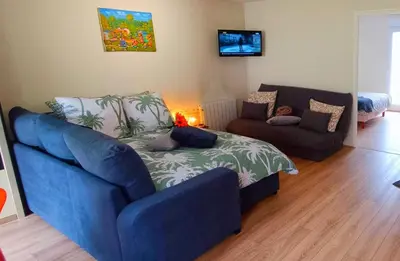 Coin salon dans l'établissement Appartement avec jardin - Centre-ville à 10 minutes à pied