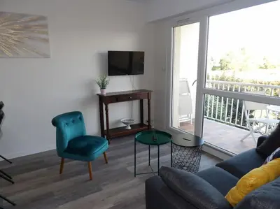 Télévision ou salle de divertissement dans l'établissement Charmant T2 tout confort Cabourg