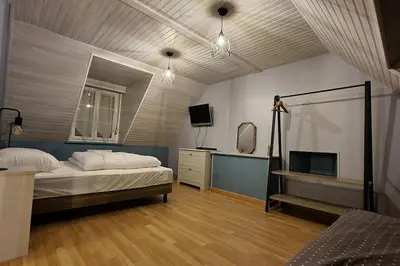 Un ou plusieurs lits dans un hébergement de l'établissement Une petite maison du Rozel - gite tout confort