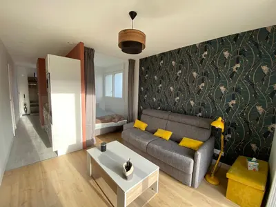 Coin salon dans l'établissement Appartement BIENVENUE