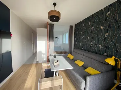 Coin salon dans l'établissement Appartement BIENVENUE