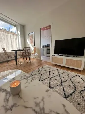 Télévision ou salle de divertissement dans l'établissement Le Studio 41