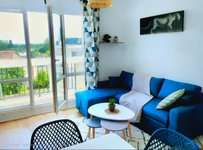 Coin salon dans l'établissement Appartement Spacieux & Parking