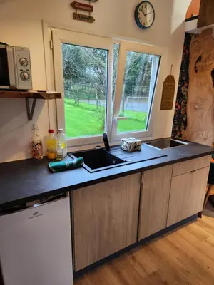 Cuisine ou kitchenette dans l'établissement le cocon d'amour 