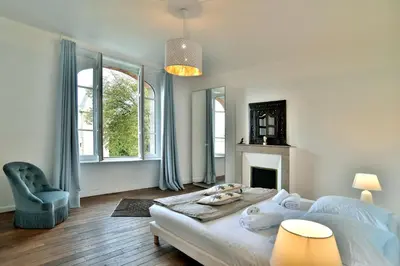 Un ou plusieurs lits dans un hébergement de l'établissement La Brise Cancalaise - Maison typique avec vue mer