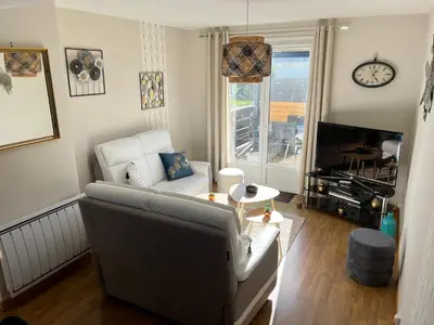 Coin salon dans l'établissement Maison à 700m de la plage