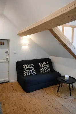 Coin salon dans l'établissement Charmant studio typique & cosy au Cœur de Caen