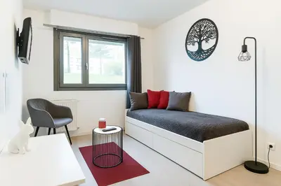 Un ou plusieurs lits dans un hébergement de l'établissement Studio Cosy & Parking privé proche Centre CAEN