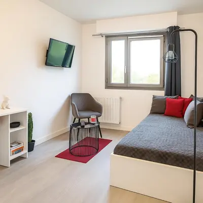 Un ou plusieurs lits dans un hébergement de l'établissement Studio Cosy & Parking privé proche Centre CAEN