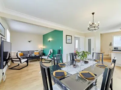 Coin salon dans l'établissement Maison de Campagne Familiale à Portbail - 6 personnes