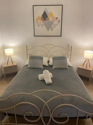 Un ou plusieurs lits dans un hébergement de l'établissement La Maison Sable - Chaleureuse Familiale avec Jardin-300m de la plage