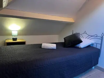 Un ou plusieurs lits dans un hébergement de l'établissement La Maison Sable - Chaleureuse Familiale avec Jardin-300m de la plage