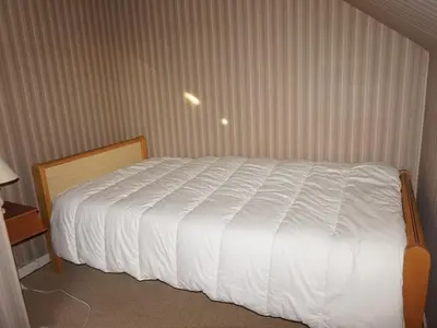 Un ou plusieurs lits dans un hébergement de l'établissement Duplex lumineux 3 chambres, terrasse, parking, à deux pas de la plage de Cabourg - FR-1-465-103